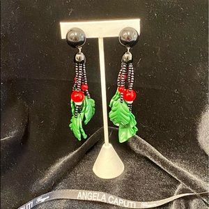 Italian designer Angela Caputi resin, clip-on drop holiday holly earrings.